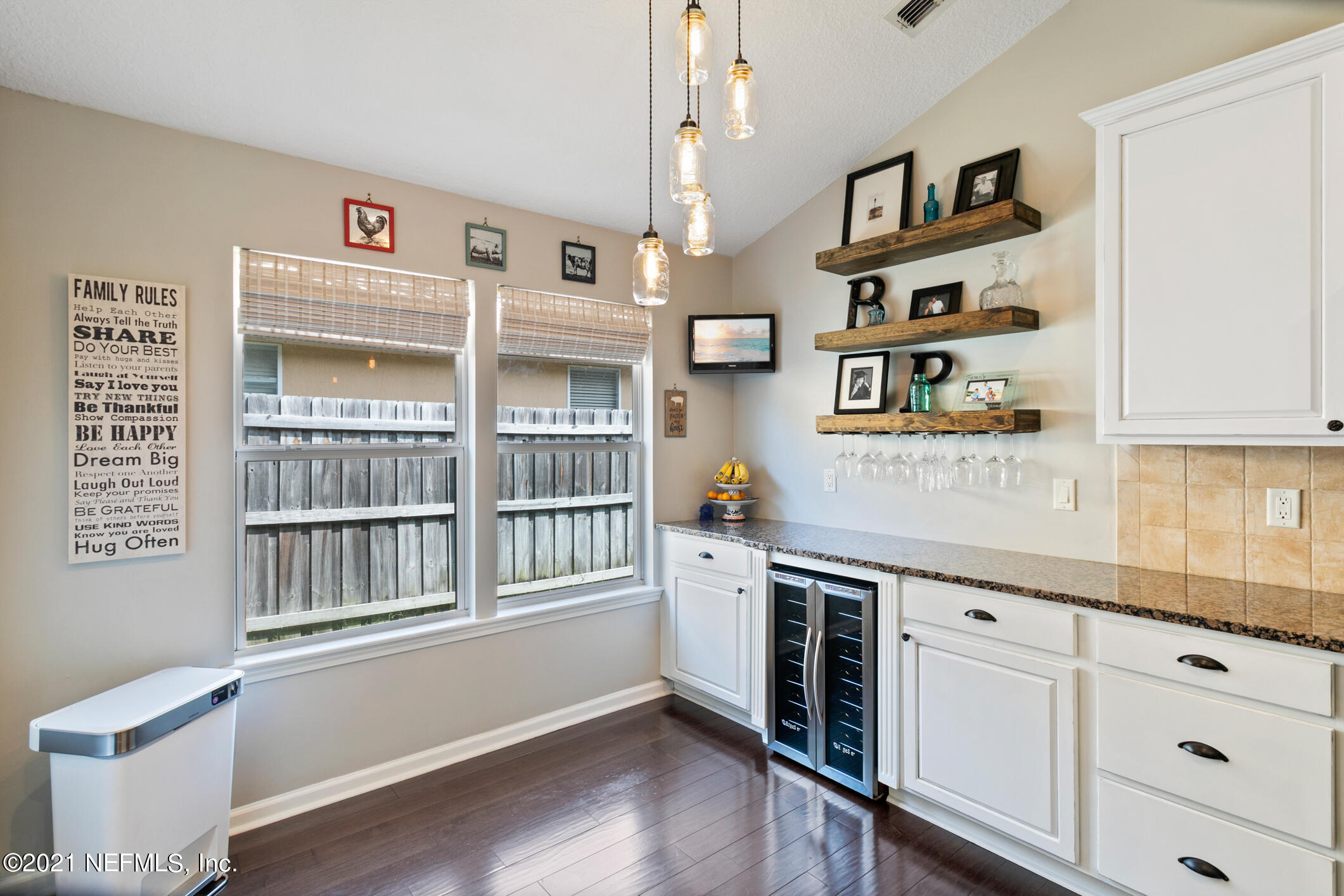 768 West Devonhurst Lane Ponte Vedra, FL 32081 - Photo 17 of 49 a kitchen with stainless steel appliances cabinets and wooden floor