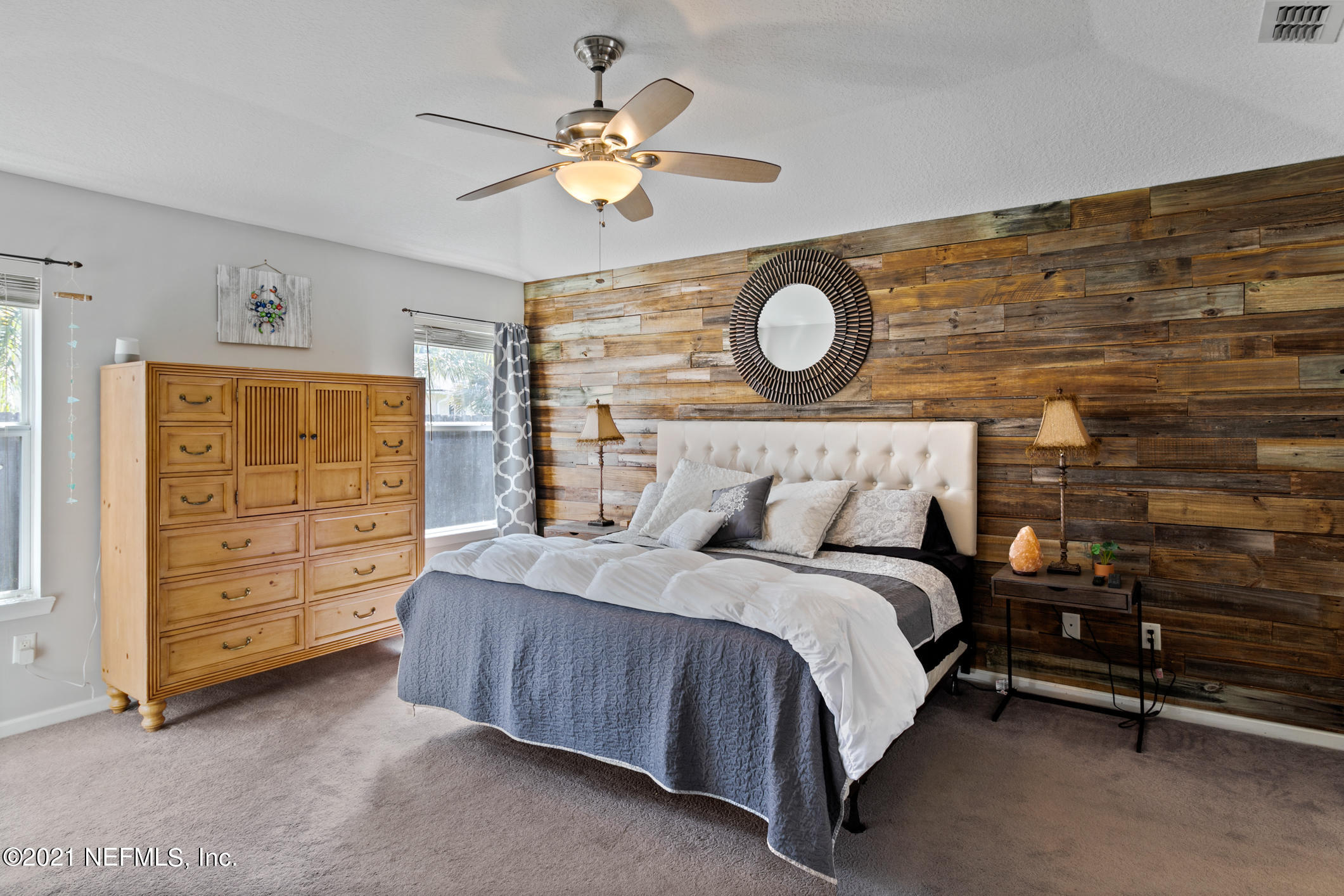 768 West Devonhurst Lane Ponte Vedra, FL 32081 - Photo 21 of 49 a bedroom with a bed and a chandelier