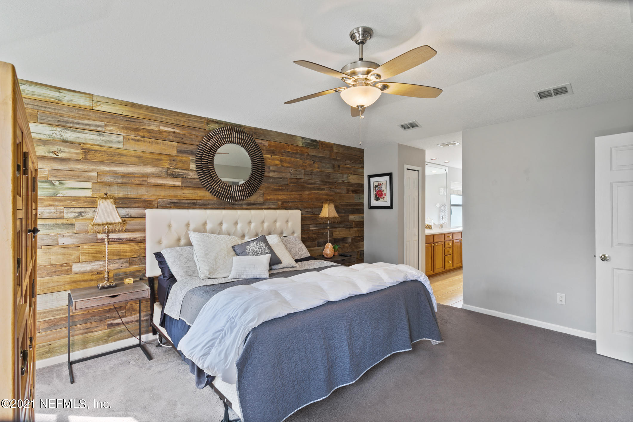 768 West Devonhurst Lane Ponte Vedra, FL 32081 - Photo 23 of 49 a bedroom with a bed and a chandelier