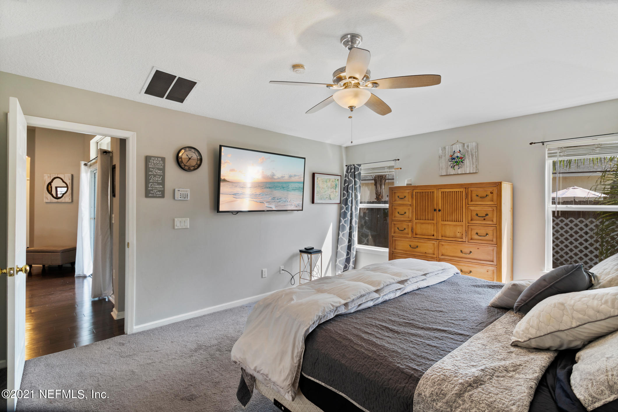 768 West Devonhurst Lane Ponte Vedra, FL 32081 - Photo 24 of 49 a bedroom with a bed and a chandelier