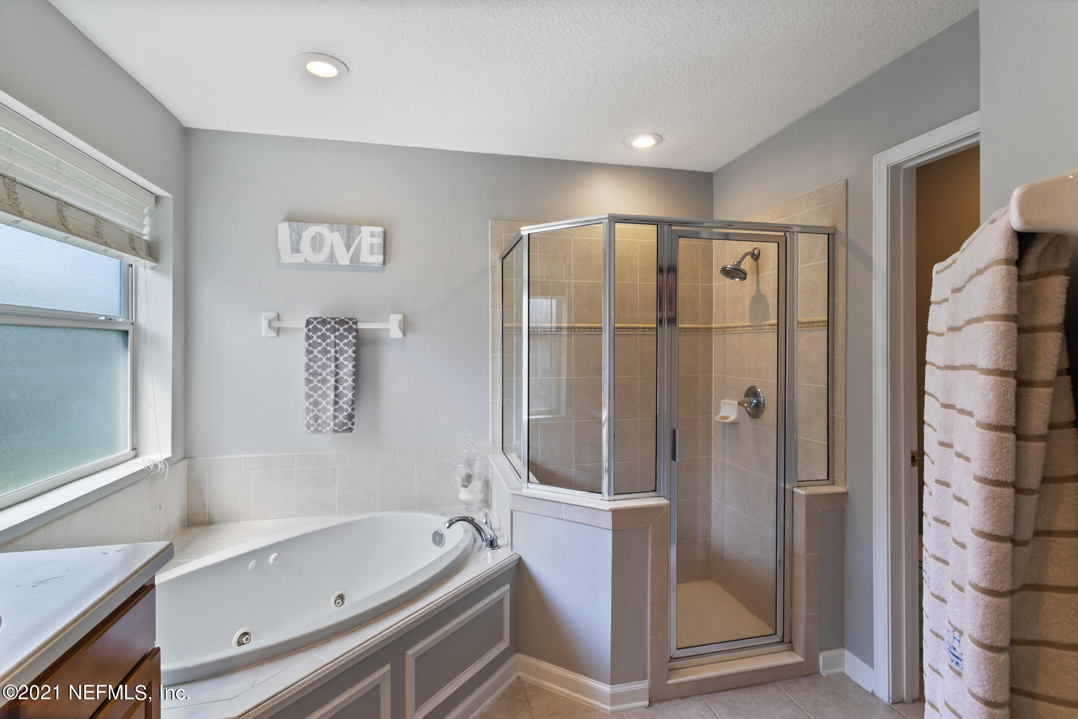 768 West Devonhurst Lane Ponte Vedra, FL 32081 - Photo 26 of 49 a bathroom with a bathtub and a shower