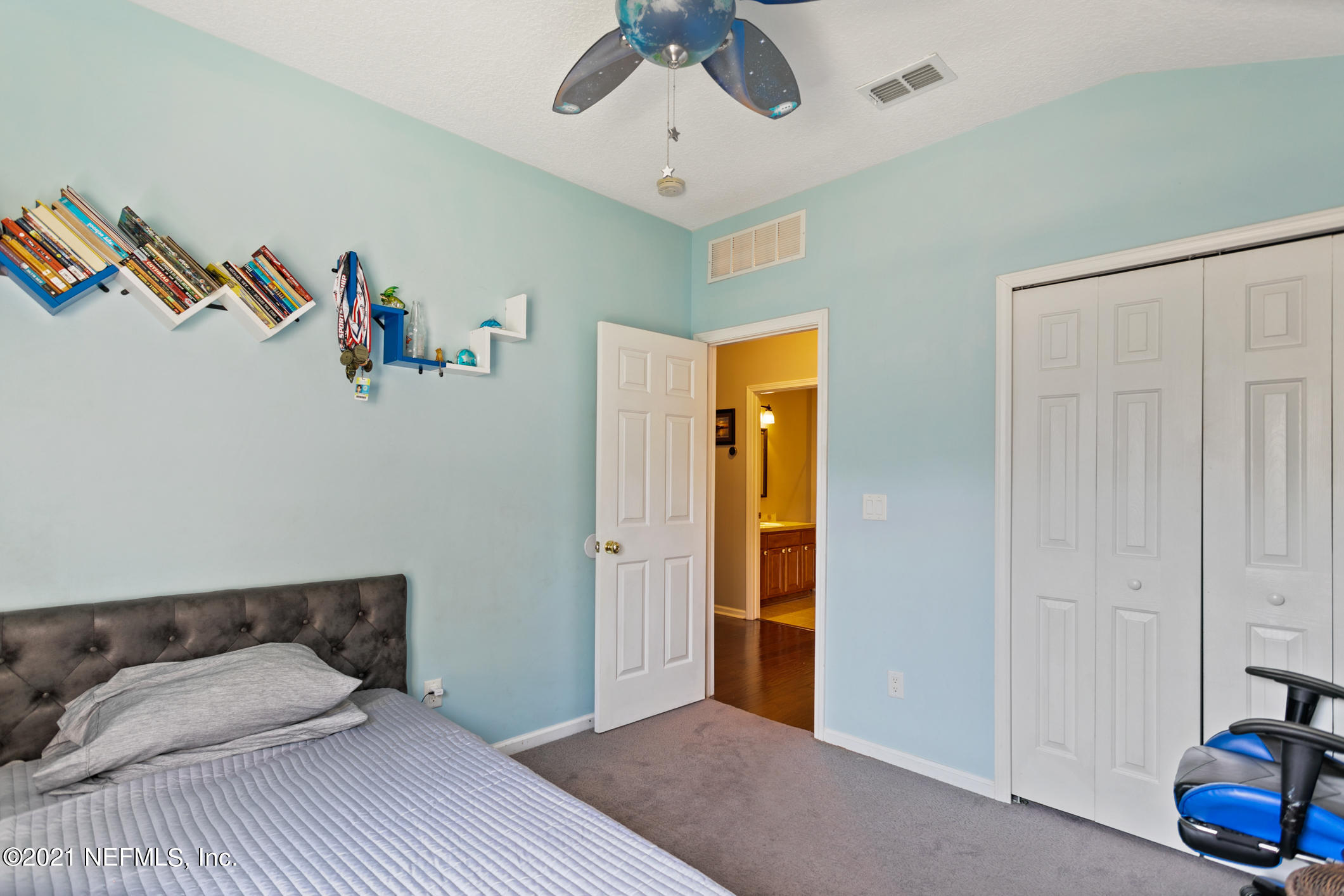 768 West Devonhurst Lane Ponte Vedra, FL 32081 - Photo 32 of 49 a bedroom with a bed and a chandelier