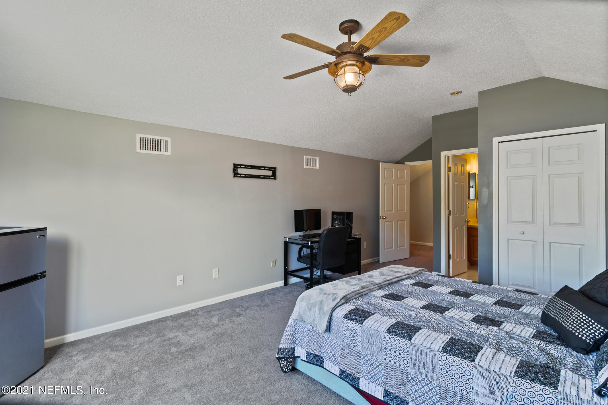 768 West Devonhurst Lane Ponte Vedra, FL 32081 - Photo 35 of 49 a bedroom with a bed and a chandelier