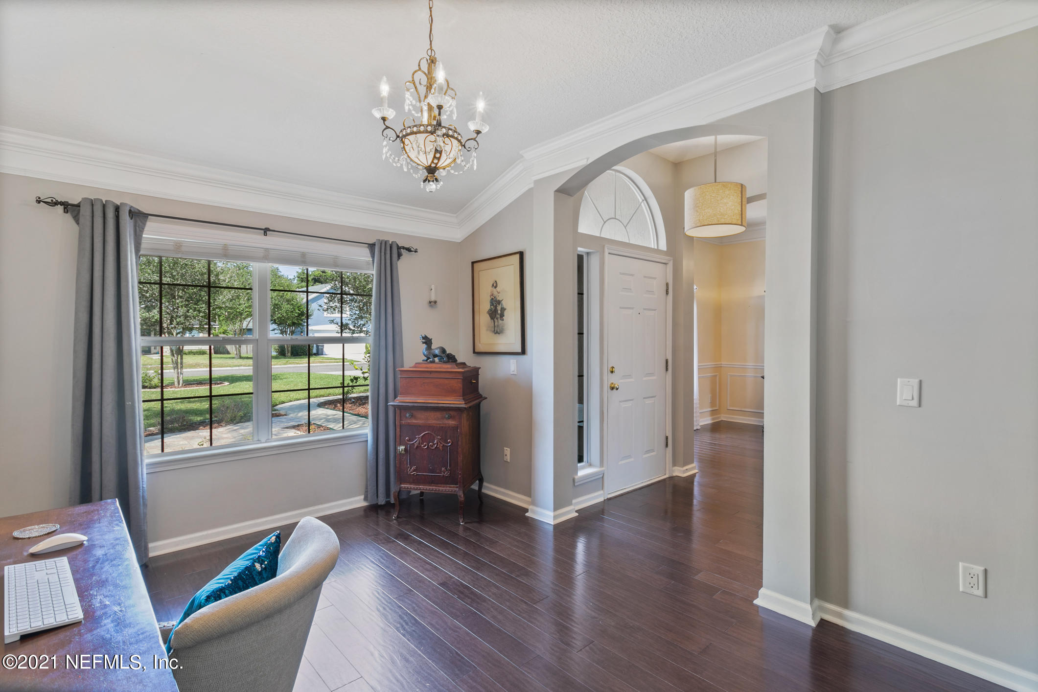 768 West Devonhurst Lane Ponte Vedra, FL 32081 - Photo 7 of 49 a living room with furniture and a chandelier