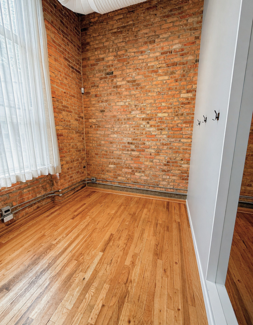 1327 West Washington Boulevard, Unit 106 Chicago, IL 60607 - Photo 14 of 23 a view of wooden floor