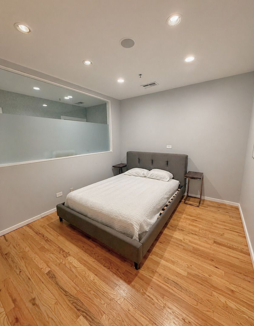 1327 West Washington Boulevard, Unit 106 Chicago, IL 60607 - Photo 15 of 23 a large white bed in a room