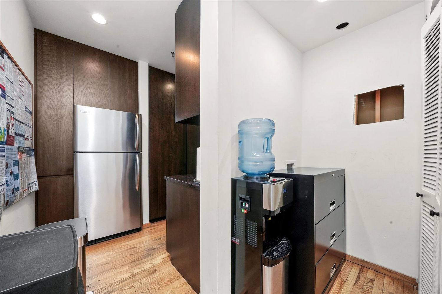 1327 West Washington Boulevard, Unit 106 Chicago, IL 60607 - Photo 19 of 23 a kitchen with a refrigerator and cabinets