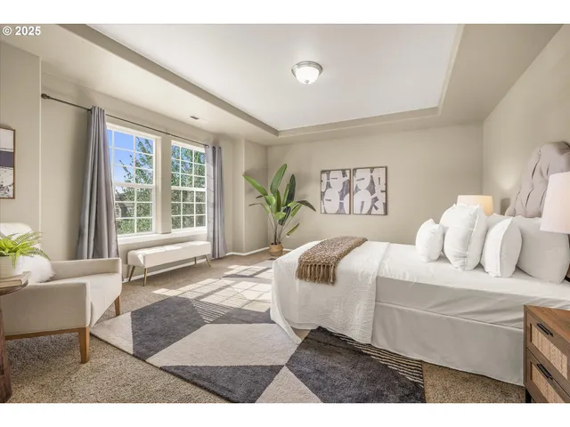 a bedroom with a large bed and a couch