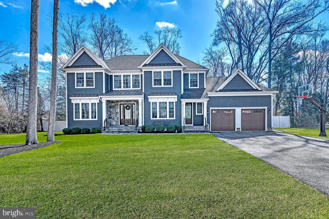 151 Sycamore Road Princeton, NJ 08540 - Photo 1 of 46 a front view of a house with a garden