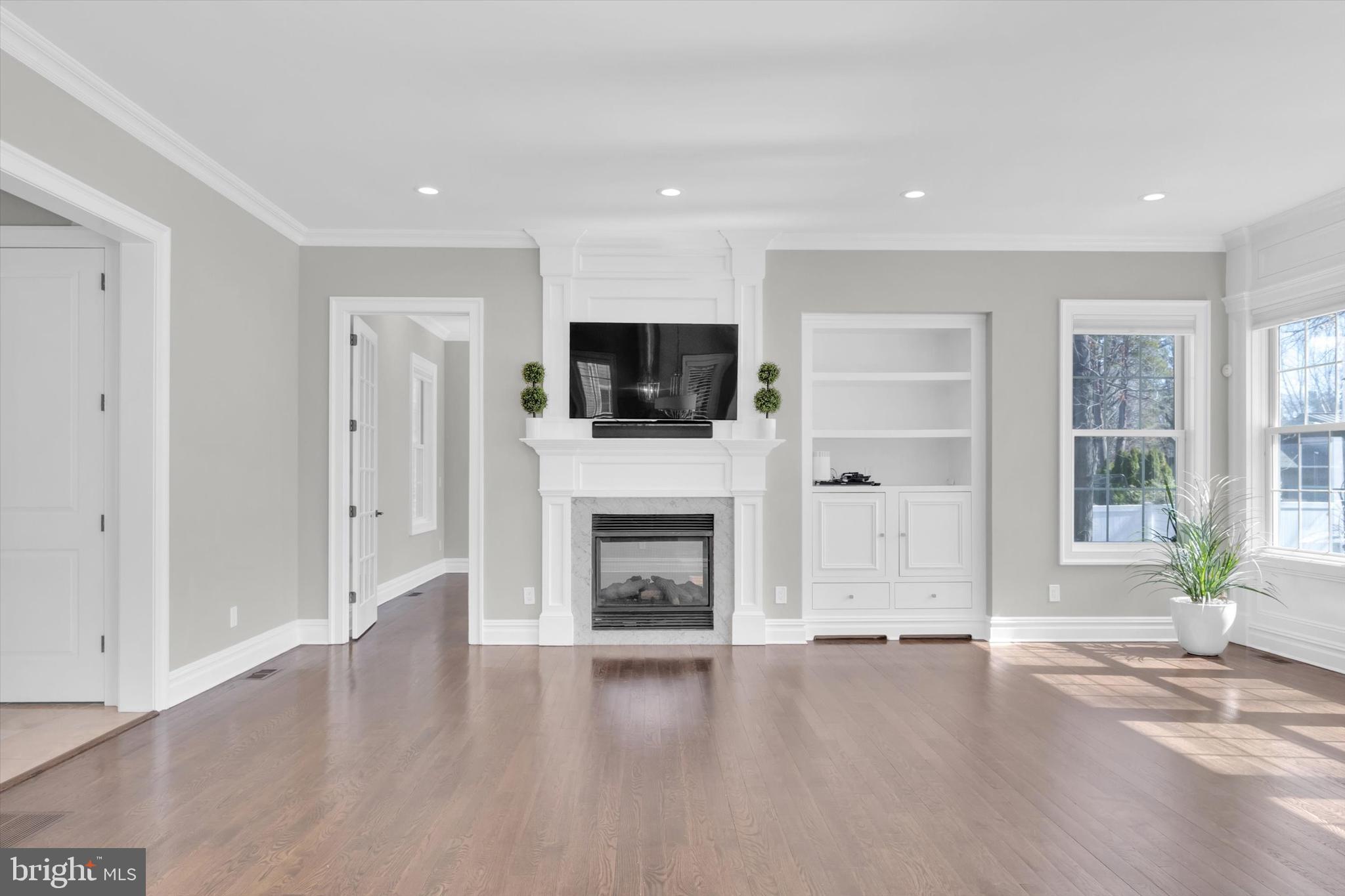 151 Sycamore Road Princeton, NJ 08540 - Photo 11 of 46 a view of a livingroom with a fireplace window and front door