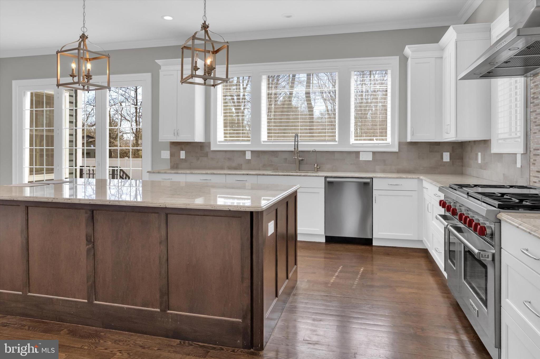 151 Sycamore Road Princeton, NJ 08540 - Photo 14 of 46 a kitchen with a sink stove top oven and cabinets