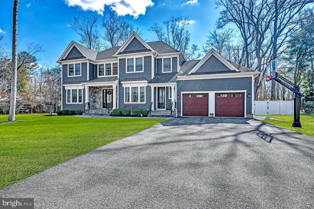 151 Sycamore Road Princeton, NJ 08540 - Photo 2 of 46 a view of a big house with a big yard and large trees