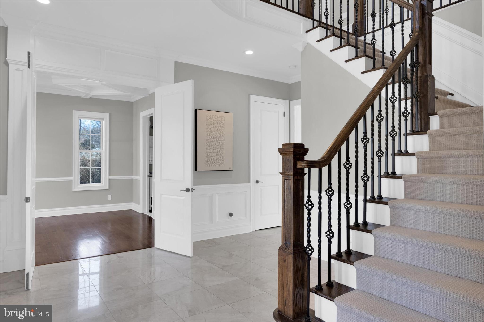 151 Sycamore Road Princeton, NJ 08540 - Photo 4 of 46 a view of a hallway with wooden floor and staircase