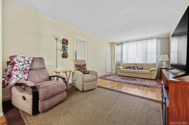 a spacious bedroom with a bed and a couch