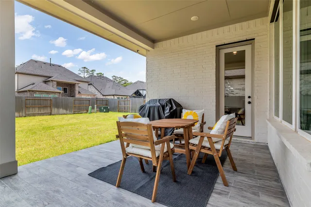 a view of a dining room with furniture and window