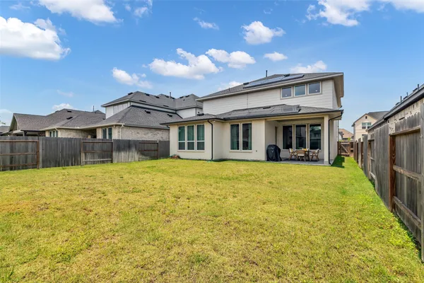 a view of a house with a swimming pool with a yard