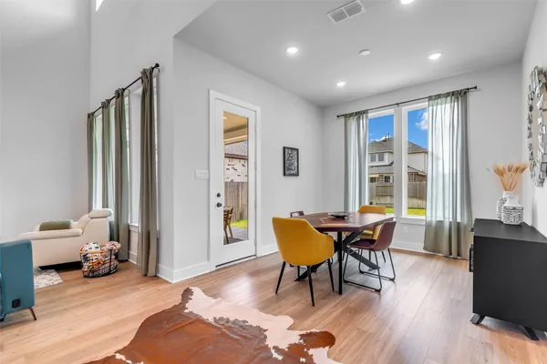 a view of a livingroom with furniture and a window