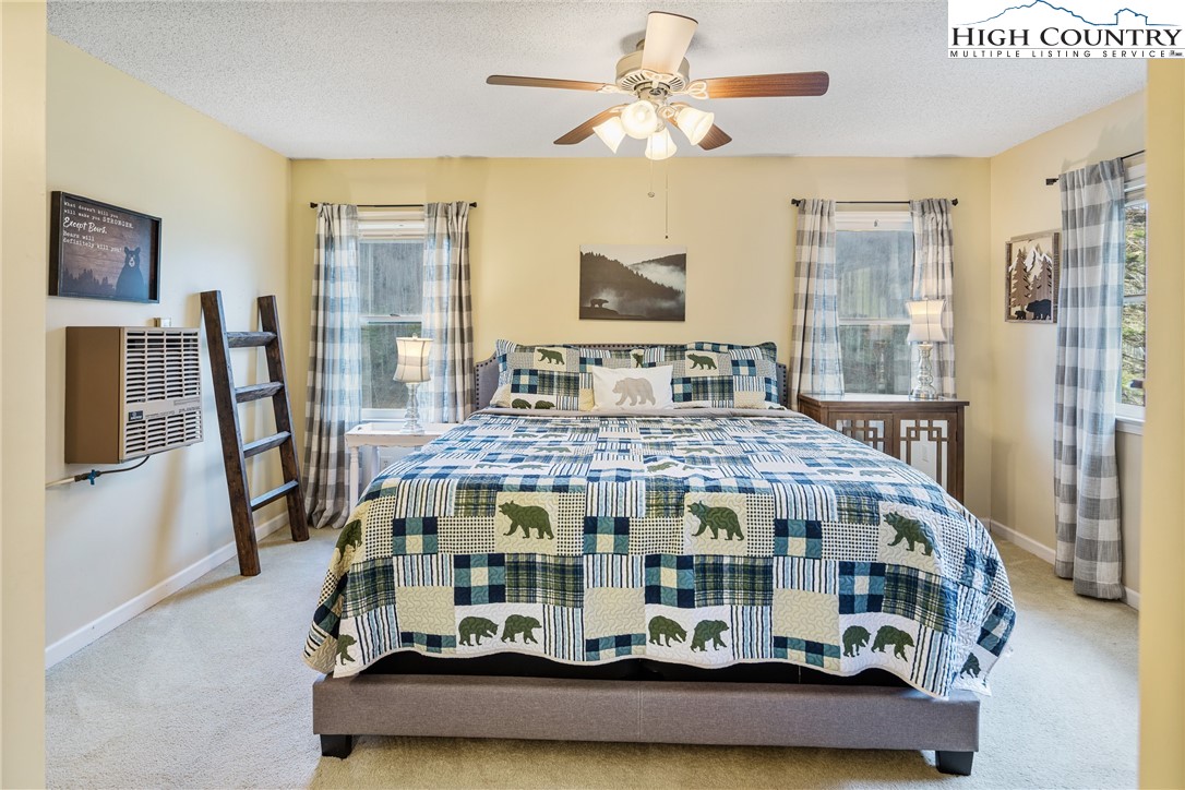 2408 Todd Railroad Grade Road Todd, NC 28684 - Photo 20 of 46 a bedroom with bed and wooden floor