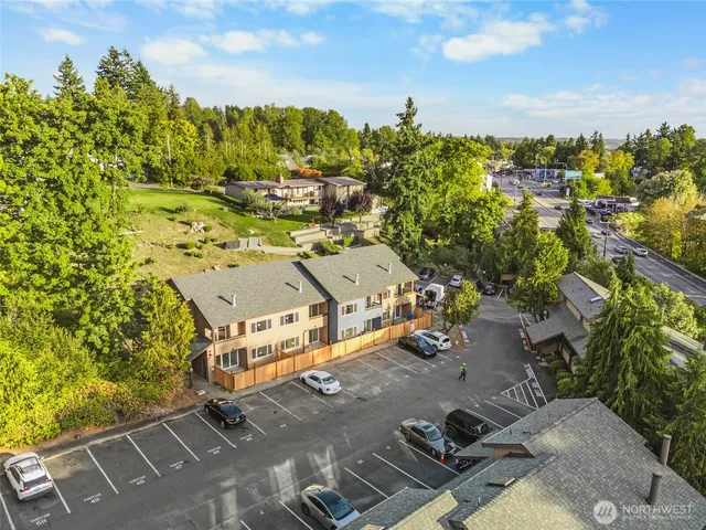 an aerial view of residential houses with outdoor space