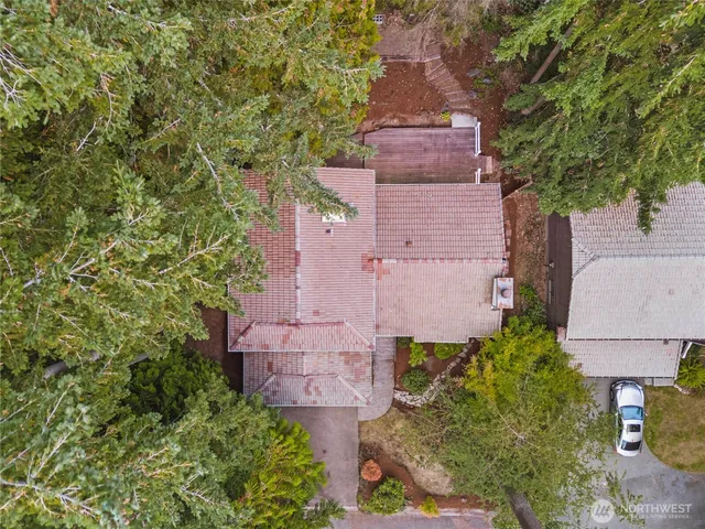 a wooden bench sitting in front of a building