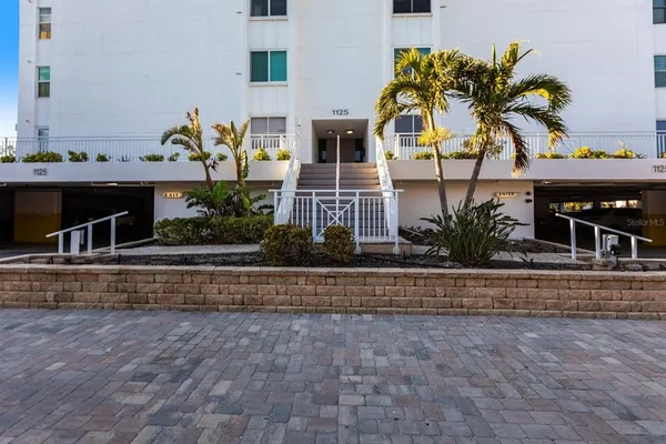 a view of front door and potted plants