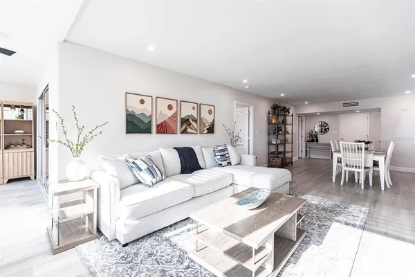 a large bedroom with a large bed and a couch