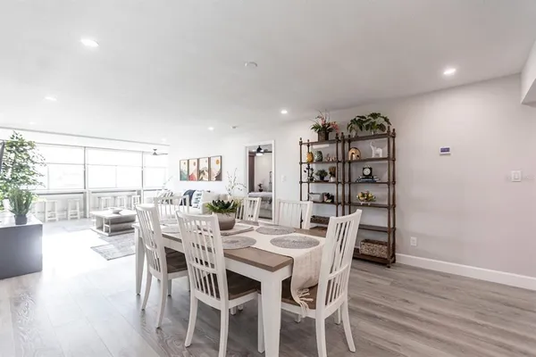 a view of a dining room with furniture and wooden floor