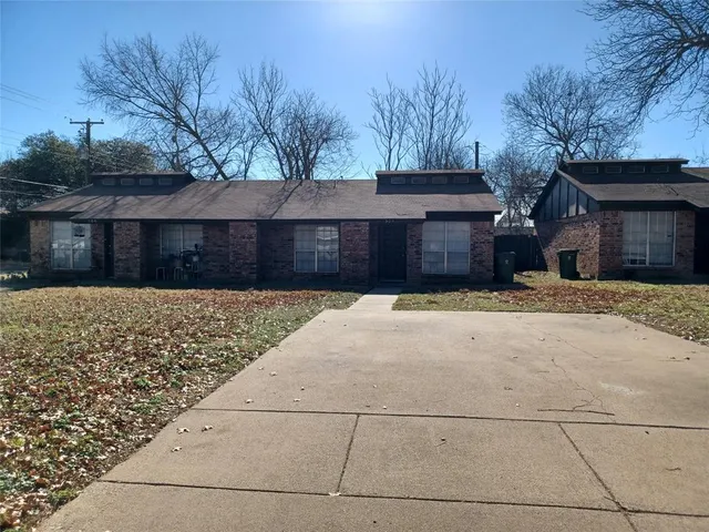 a front view of house with a yard