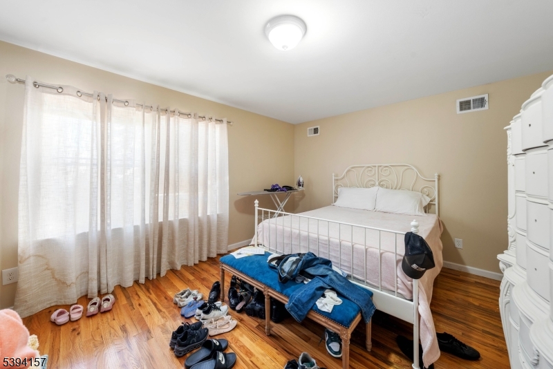 1073 Bond Street Elizabeth, NJ 07201 - Photo 12 of 30 a bedroom with furniture and a bed