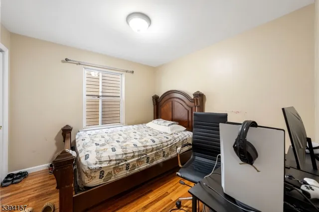 a bedroom with bed and a window