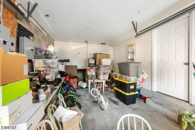 a view of an empty room with closet and a window