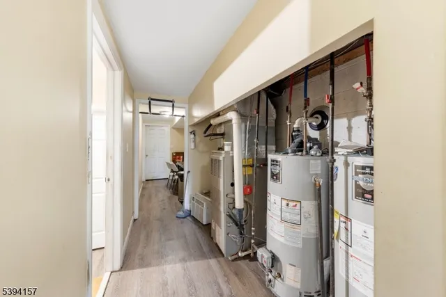 a view of a house with a small yard and wooden fence