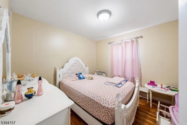 a bedroom with a bed and a table