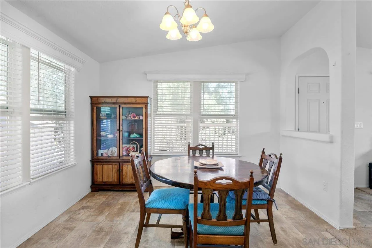 9100 Single Oak Drive Lakeside, CA 92040 - Photo 11 of 28 a view of a dining room with furniture and chandelier