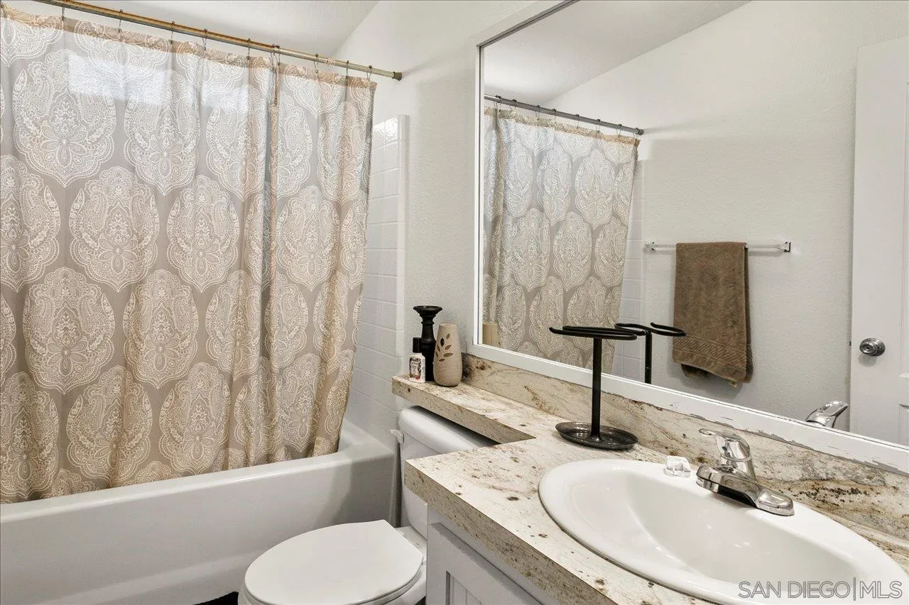 9100 Single Oak Drive Lakeside, CA 92040 - Photo 17 of 28 a bathroom with a sink toilet and shower