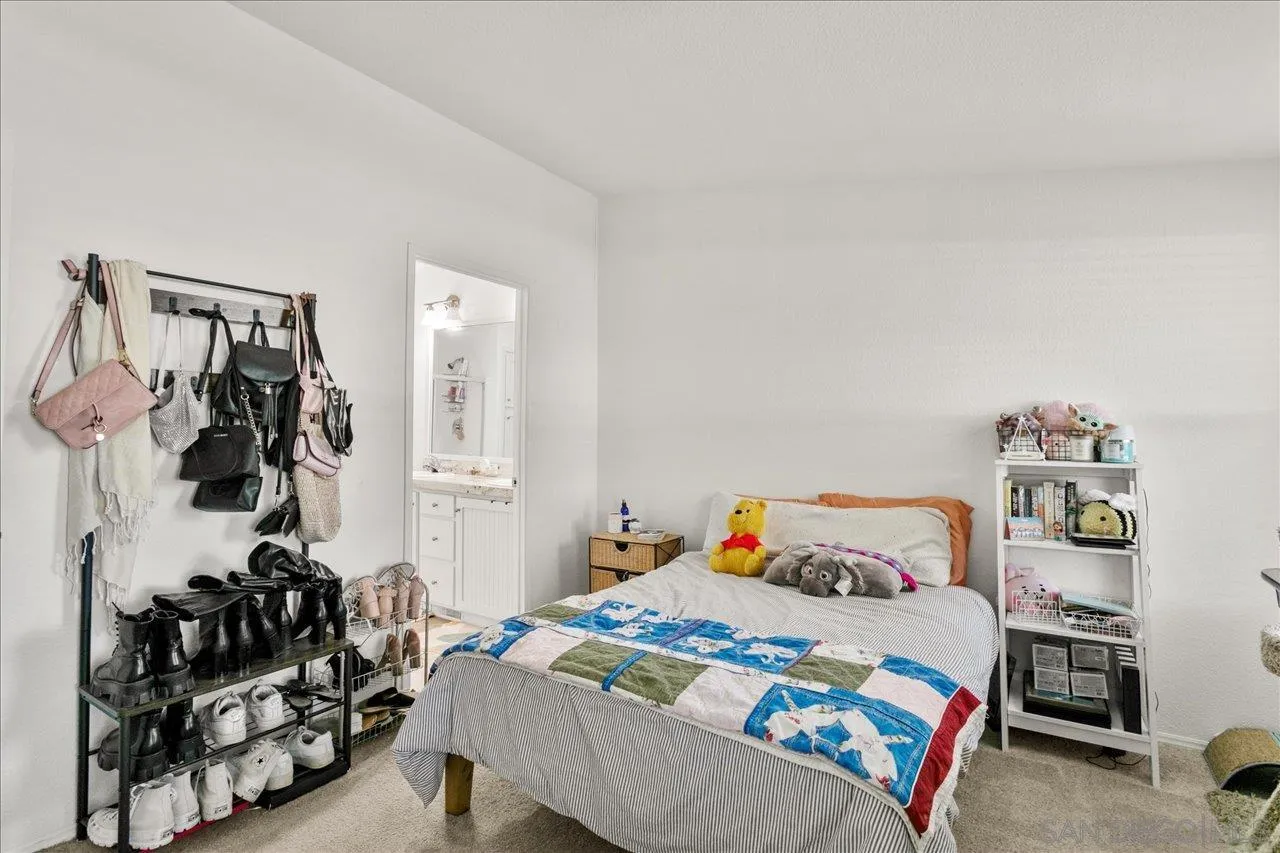 9100 Single Oak Drive Lakeside, CA 92040 - Photo 23 of 28 a bedroom with a bed and walk in closet