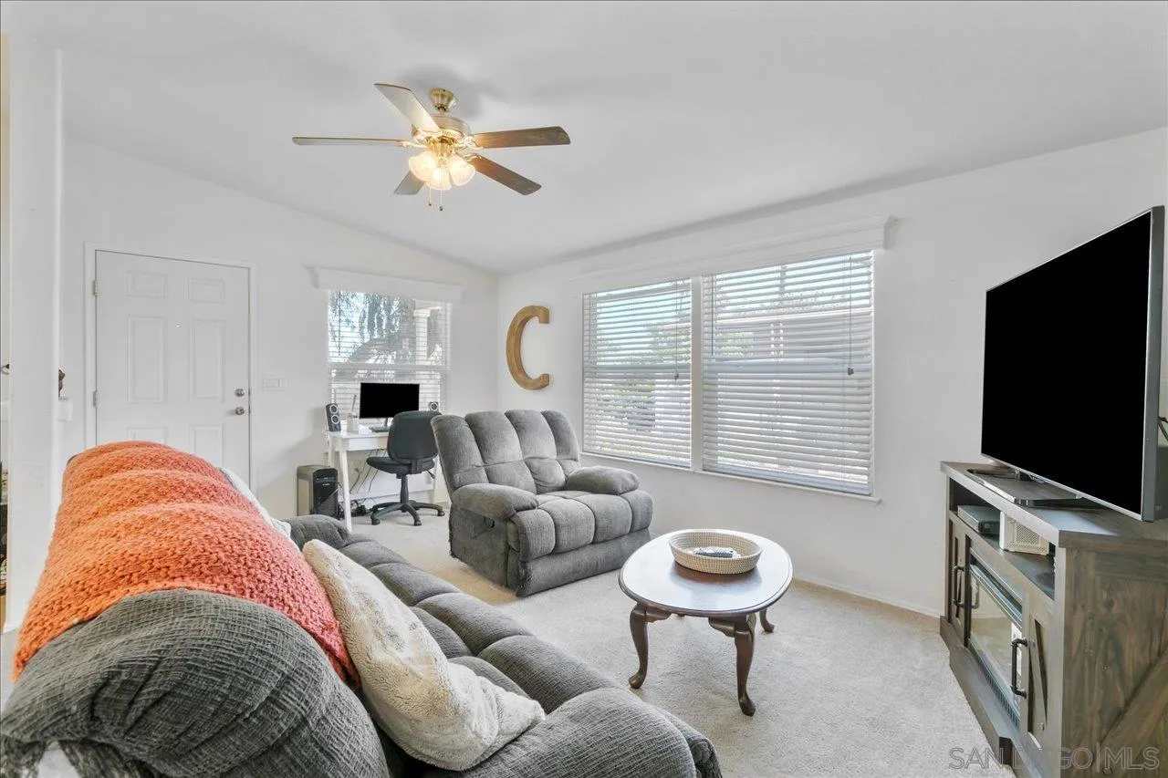 9100 Single Oak Drive Lakeside, CA 92040 - Photo 7 of 28 a living room with furniture and a flat screen tv