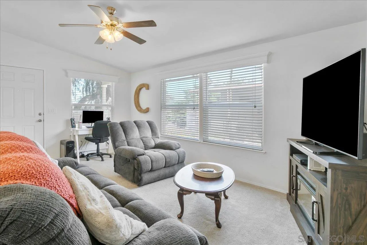 9100 Single Oak Drive Lakeside, CA 92040 - Photo 8 of 28 a living room with furniture and a flat screen tv