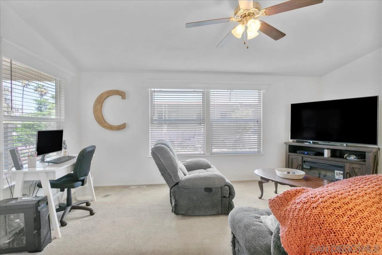9100 Single Oak Drive Lakeside, CA 92040 - Photo 9 of 28 a living room with furniture and a flat screen tv