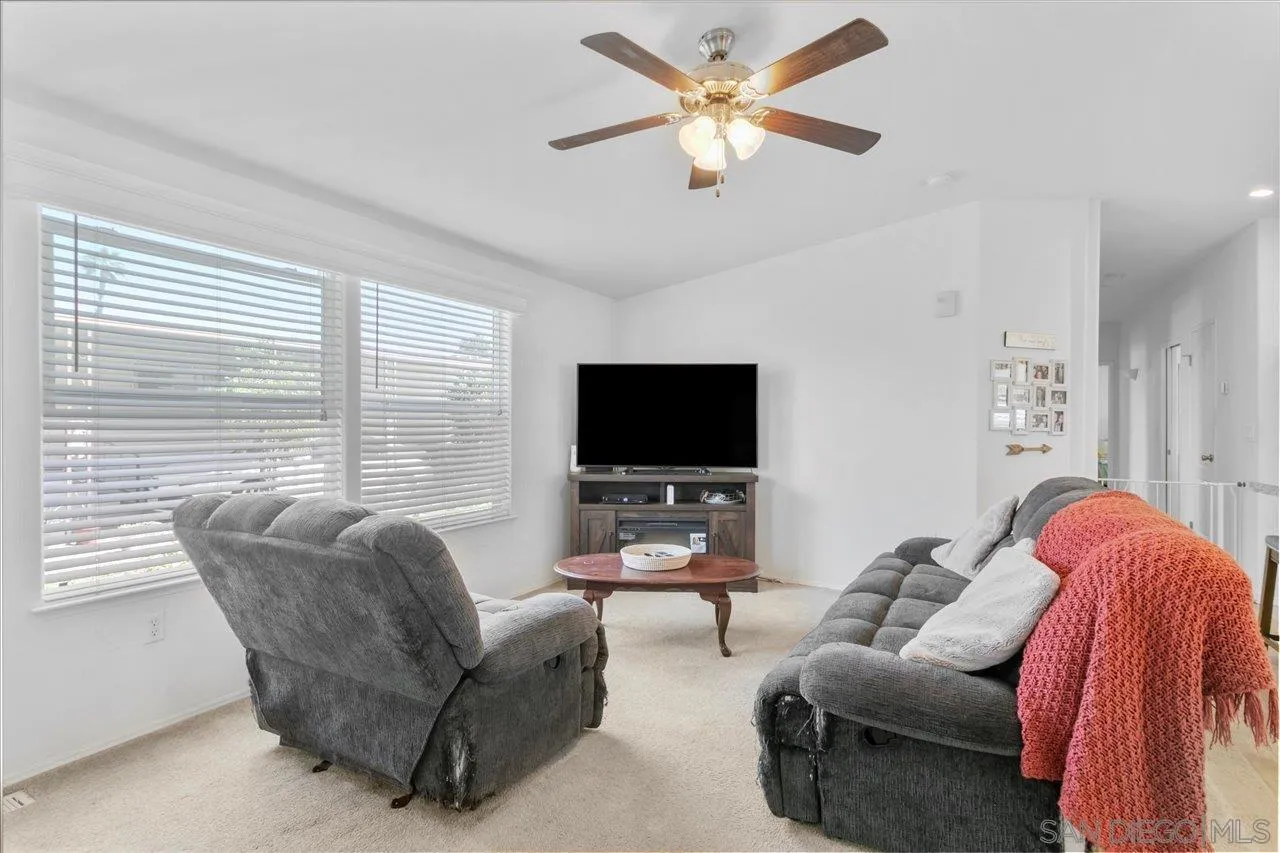 9100 Single Oak Drive Lakeside, CA 92040 - Photo 10 of 28 a living room with furniture and a flat screen tv