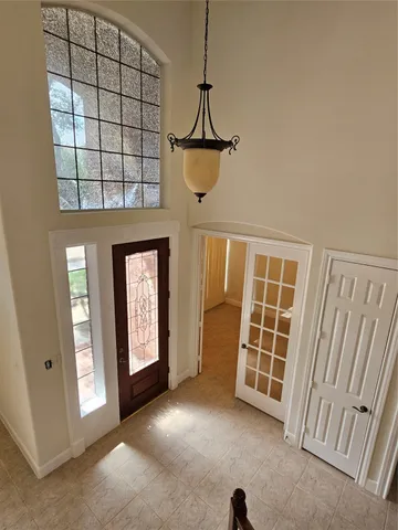 a spacious bathroom with a double vanity sink and a mirror
