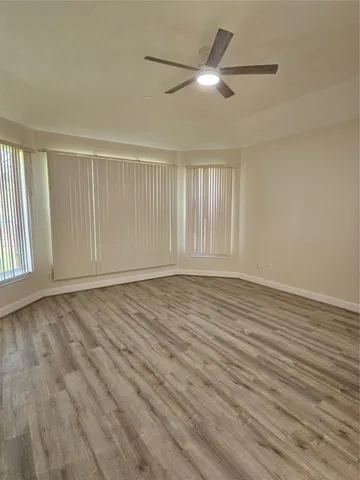 a bathroom with a tub a sink a mirror and a shower