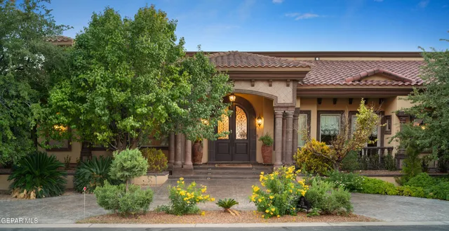 a living room with furniture a window and a chandelier