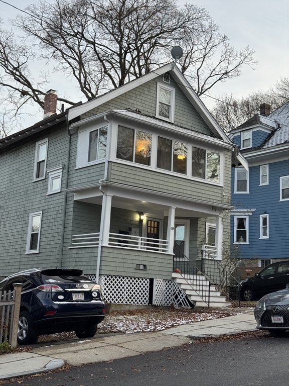68 Aldrich Street, Unit 2 Boston, MA 02131 - Photo 1 of 12 a front view of a house with parking space