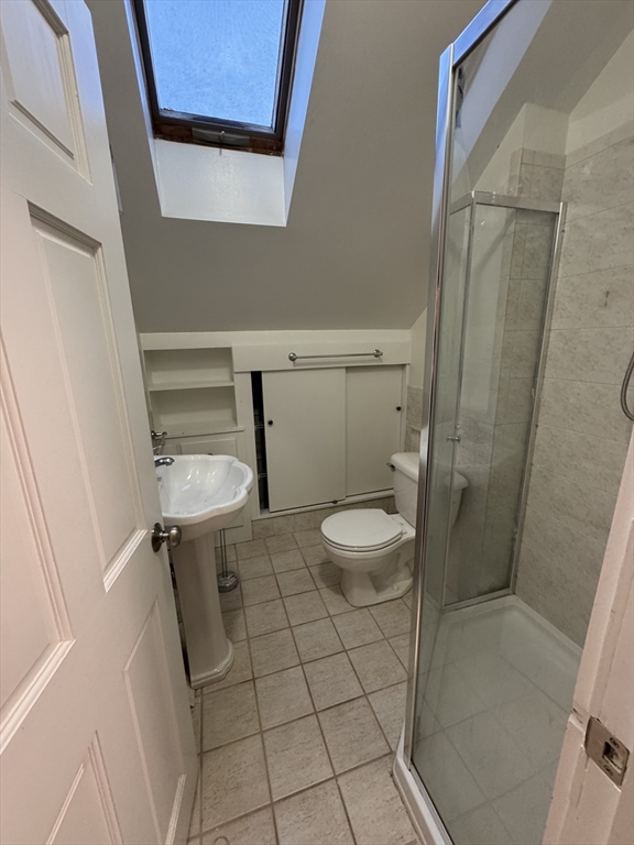68 Aldrich Street, Unit 2 Boston, MA 02131 - Photo 11 of 12 a bathroom with a toilet and a shower