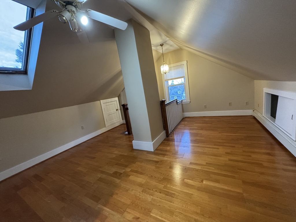 68 Aldrich Street, Unit 2 Boston, MA 02131 - Photo 12 of 12 a view of an empty room with wooden floor and a window