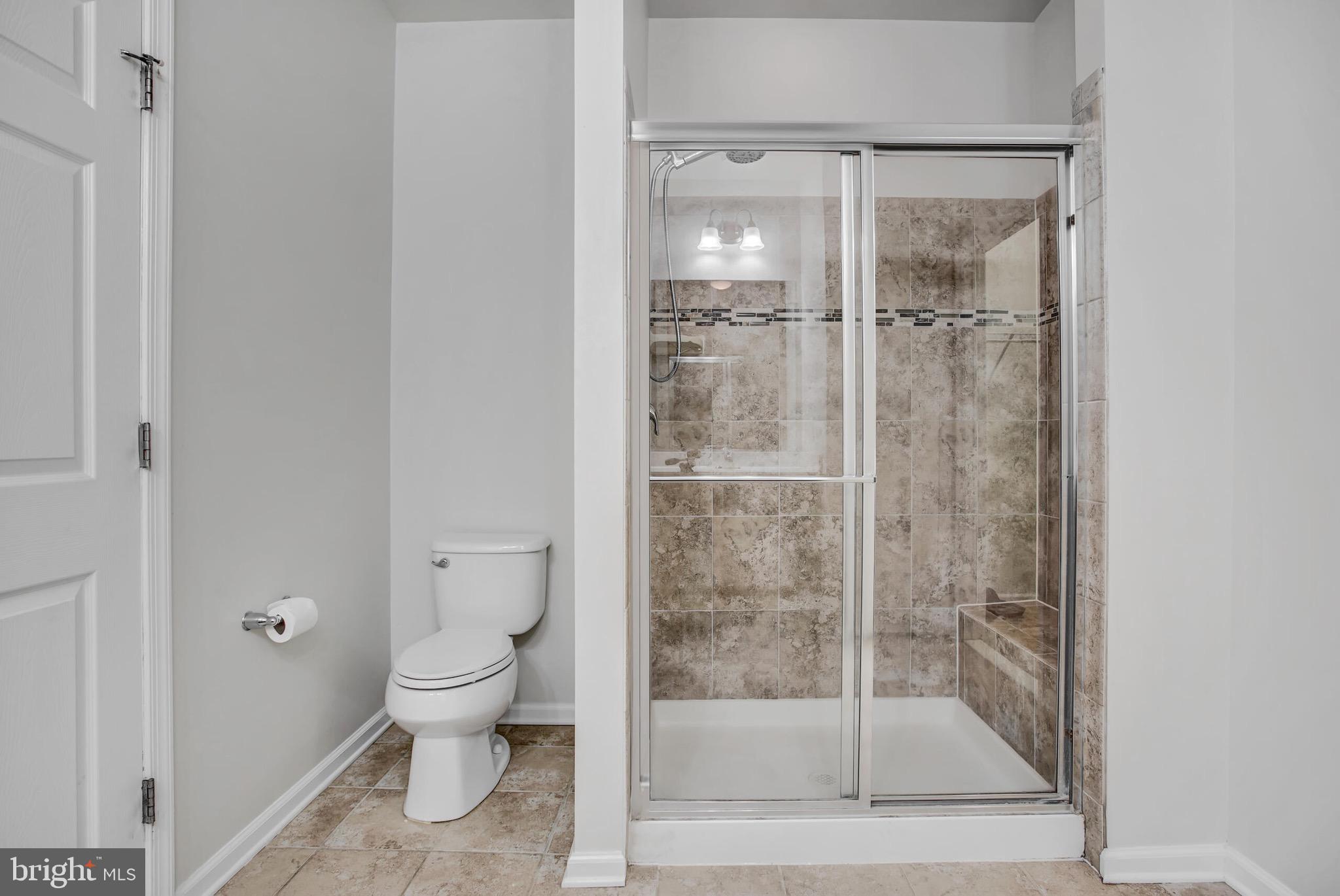 20586 Maitland Terrace Ashburn, VA 20147 - Photo 12 of 24 a bathroom with a toilet and a shower