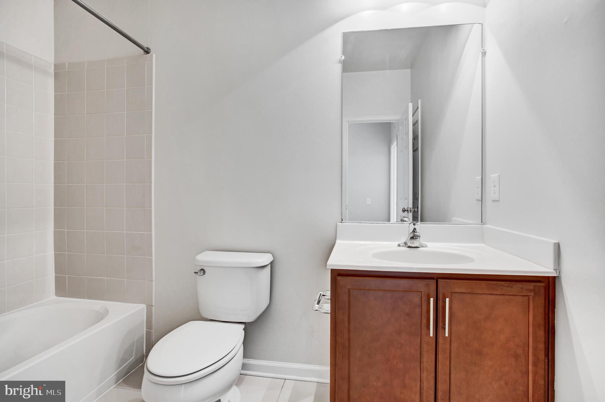 20586 Maitland Terrace Ashburn, VA 20147 - Photo 15 of 24 a bathroom with a granite countertop sink toilet and shower