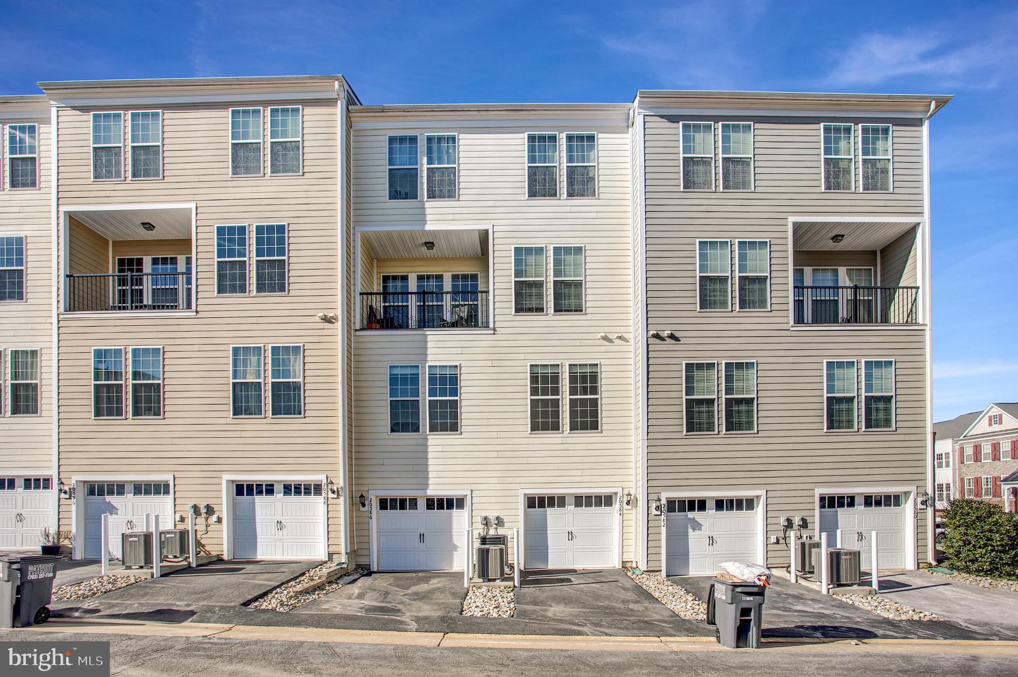 20586 Maitland Terrace Ashburn, VA 20147 - Photo 23 of 24 a front view of a building with a street