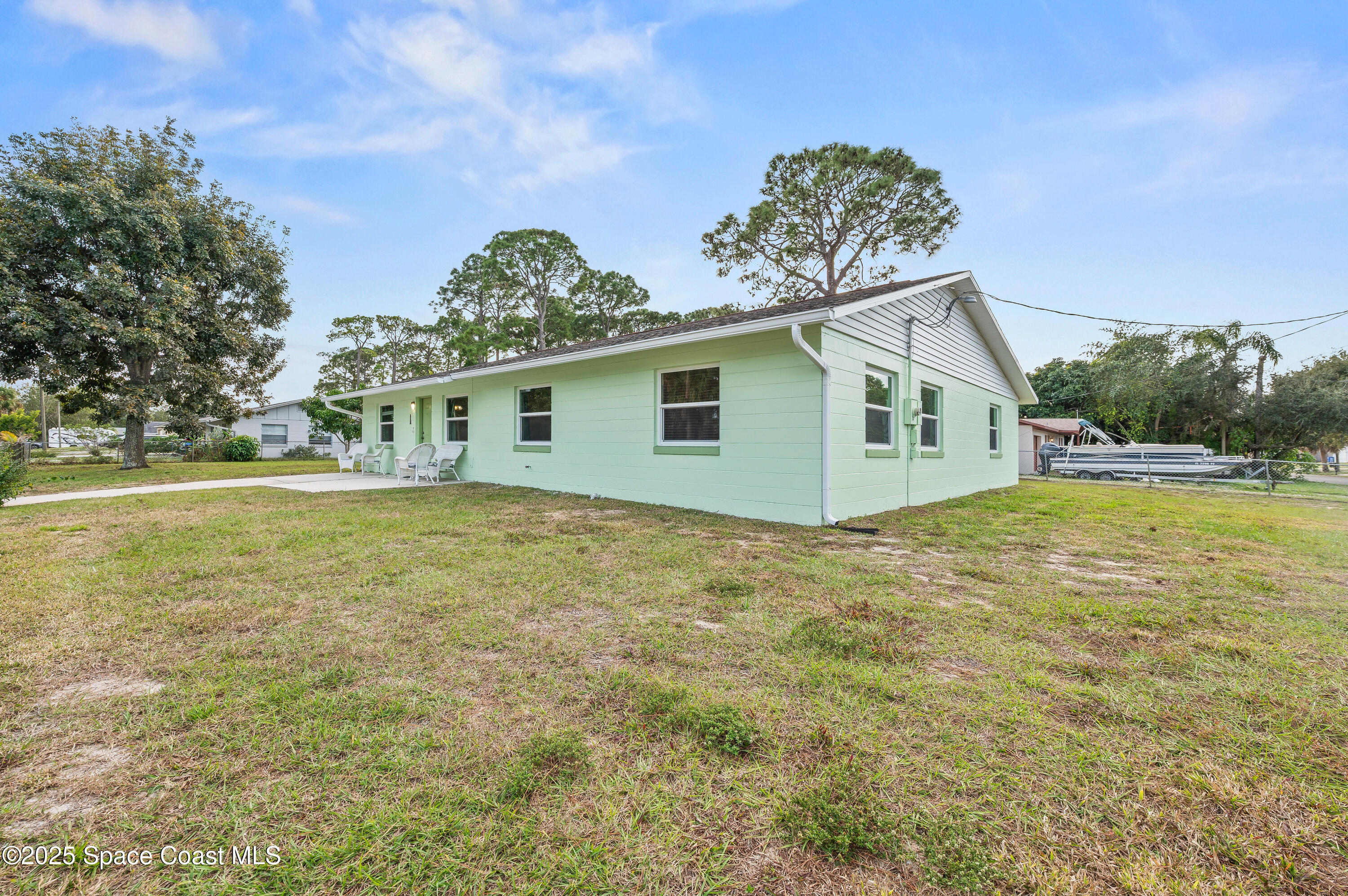 6450 Ember Avenue Cocoa, FL 32927 - Photo 2 of 40 a view of a house with a yard